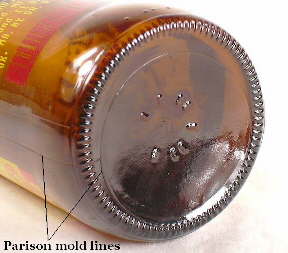 Modern beer bottle showing parison mold lines; click to enlarge.