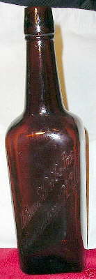 Circa 1915 to 1925 wine bottle shaped like a spirits bottle; click to enlarge.