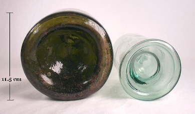 View of the base of two free-blown European liquor/wine bottles; click to enlarge.