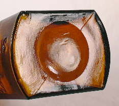 Close-up view of a post mold bottom on a late 1880's medicine bottle; click to enlarge.