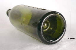 Close-up view of the push-up base of circa 1900 turn mold bottle; click to enlarge.