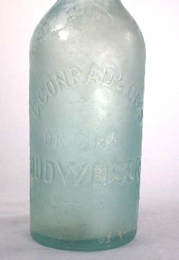 Milky stain on an 1880 beer bottle; click to enlarge.