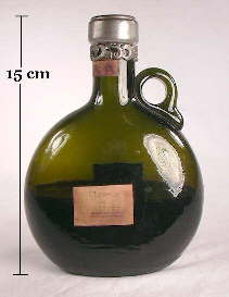 Applied handle liquour bottle from the late 19th century; click to enlarge.