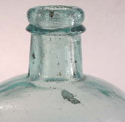 Large potstone in an 1870's medicine bottle; click to enlarge.