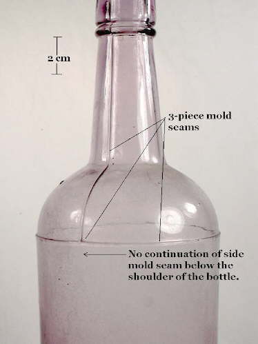 Three-piece mold liquor bottle with the mold seams pointed out; click to enlarge.