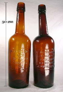 Pair of plate molded Western whiskey bottles; click to enlarge.