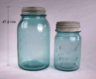 A pair of Ball Mason jars in the distinct "Ball Blue" color.