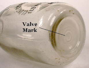 Nevada milk bottle exhibiting a faint straw cast; click to enlarge.