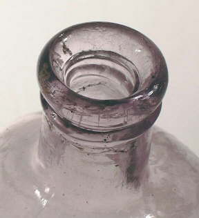 Image of an ammonium bottle with an inside thread finish showing the threads; click to enlarge.