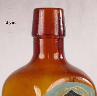 Image of an oil finish on a machine-made tonic bottle; click to enlarge.