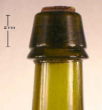 Image of a mineral finish on a mid 19th century liquor bottle; click to enlarge.