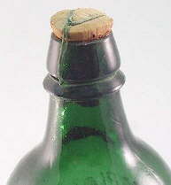 Wired down cork on miineral water bottle; click to enlarge.