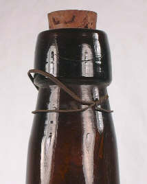 Image of a cork in a blob finish on a malt tonic bottle.