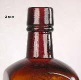 Image of a brandy finish on a machine-made medicinal tonic bottle; click to enlarge.