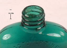 Image of an early 20th century medicine bottle with a ground external screw thread finish; click to enlarge.