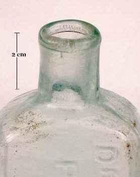 Image of an 1870's paten medicine bottle with an inwardly rolled finish; click to enlarge.