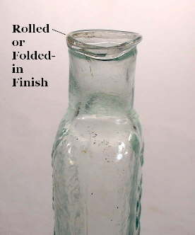 Image of a mid 19th century hair tonic bottle with a crudely inwardly rolled or folded finish; click to enlarge.