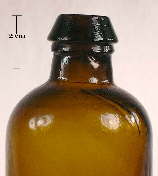Image of a mineral finish on an mid 19th century ink or utility bottle; click to enlarge.