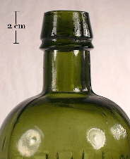 Image of a mineral finish on an mid 19th century patent medicine bottle; click to enlarge.