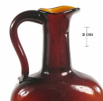 Image of a mid 19th century liquor bottle with a pouring finish; click to enlarge.