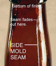 Side mold seam on early 20th century beer bottle.