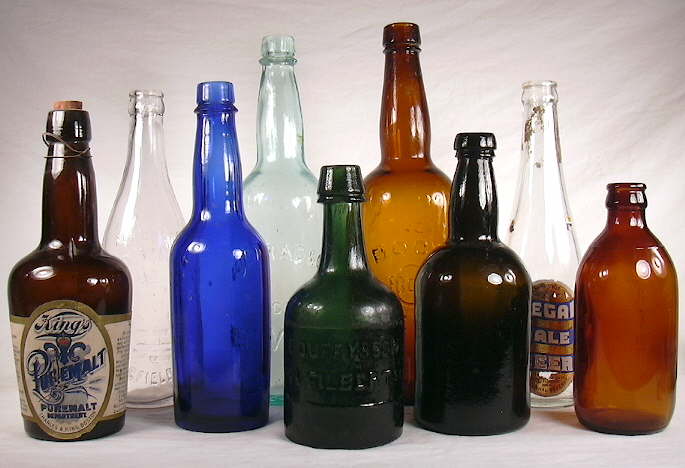 Beer bottles dating from 1860 to 1930; click to enlarge.