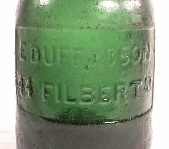 Close-up image of a plate on a mid-1850s porter bottle; click to enlarge.