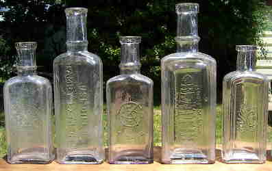 Group of late 19th century extract bottles; click to enlarge.