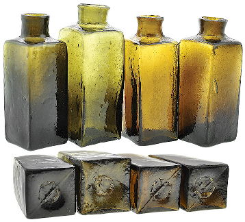 Four early American blacking bottles - ca 1820s-1840s