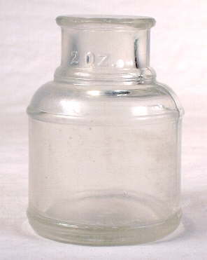 Cylindrical ink bottlel from 1940; click to enlarge.