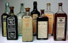 Group of eight medicine bottles; click to enlarge.