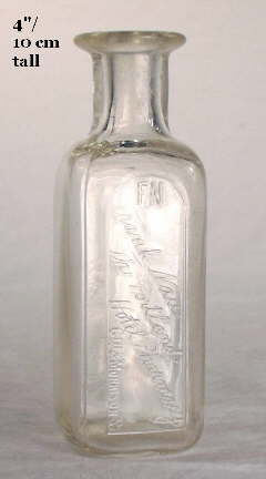 Early 20th century rounded square druggist bottle; click to enlarge.