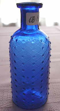 Lattice embossed poison bottle; click to enlarge.