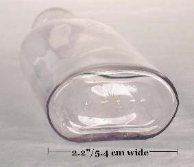 Oval druggist bottle looking straight on at the base; click to enlarge.