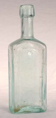 Mid-19th century paneled medicinal bottle; click to enlarge.