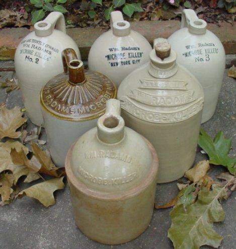 Late 19th to early 20th century pottery Microbe Killer jugs.