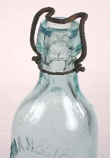 MINIATURE OF 1882 PUMP ON TOP OF A BOTTLE