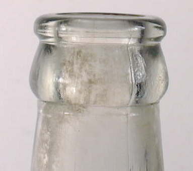 Close-up of the finish or lip of the Mission bottle.