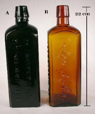 Full view of a pair of square bitters type bottles.