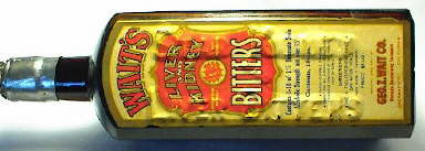 Waits Bitters label over a Star Bitters bottle embossing; click to enlarge.