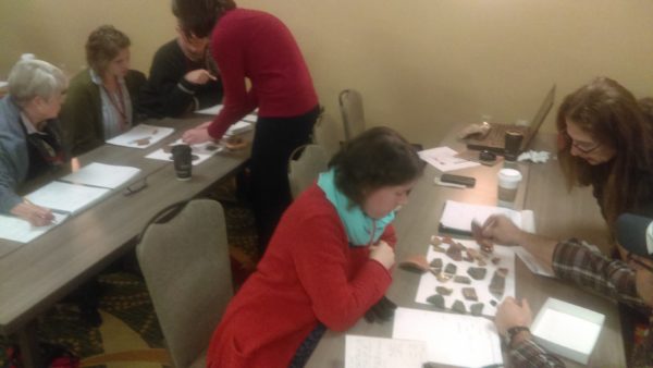 Participants at tables sorting sherds